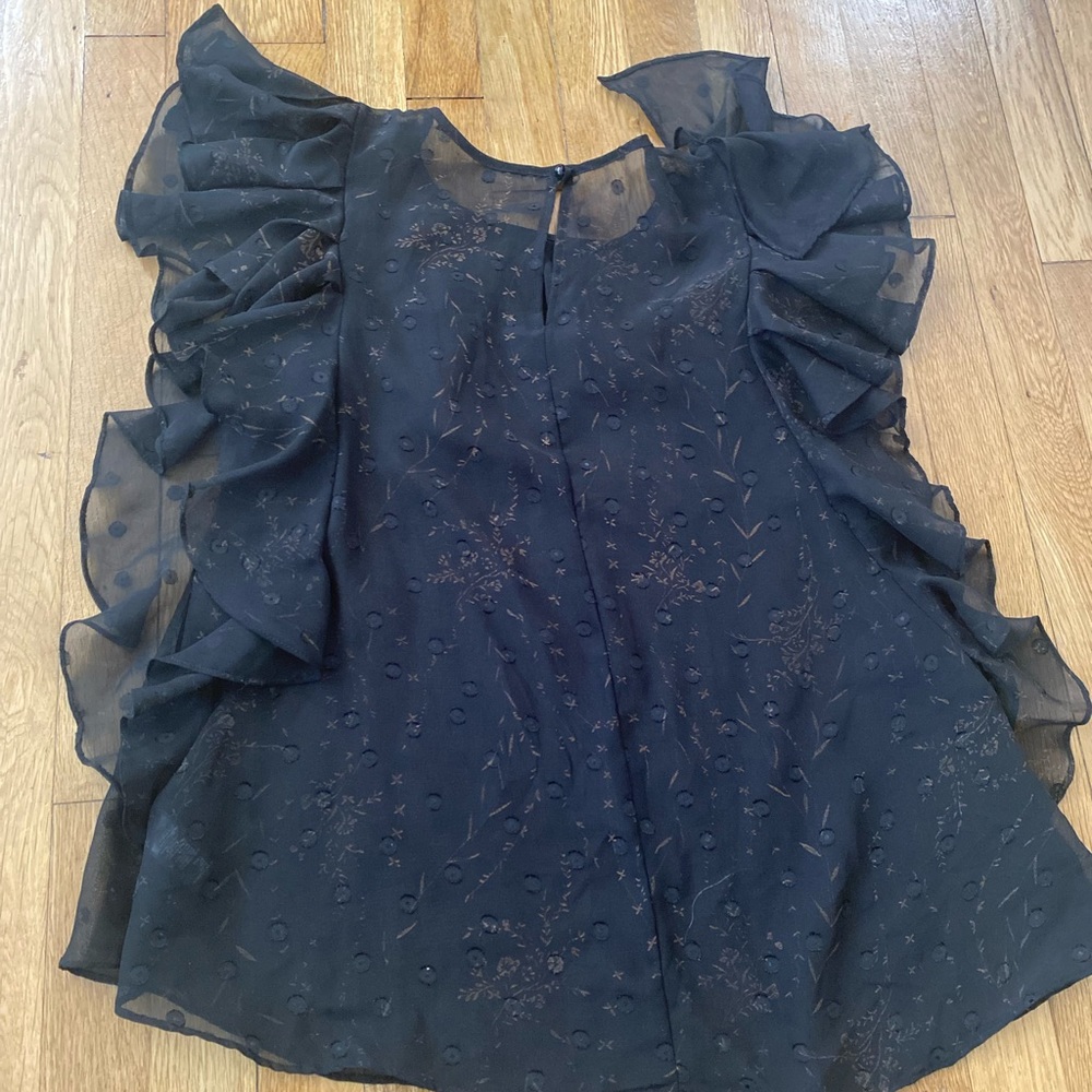 Free people patterned tan and black top. Size small